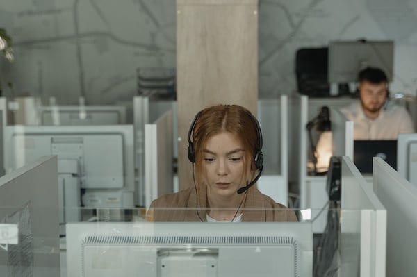 Woman with headset at a contact center