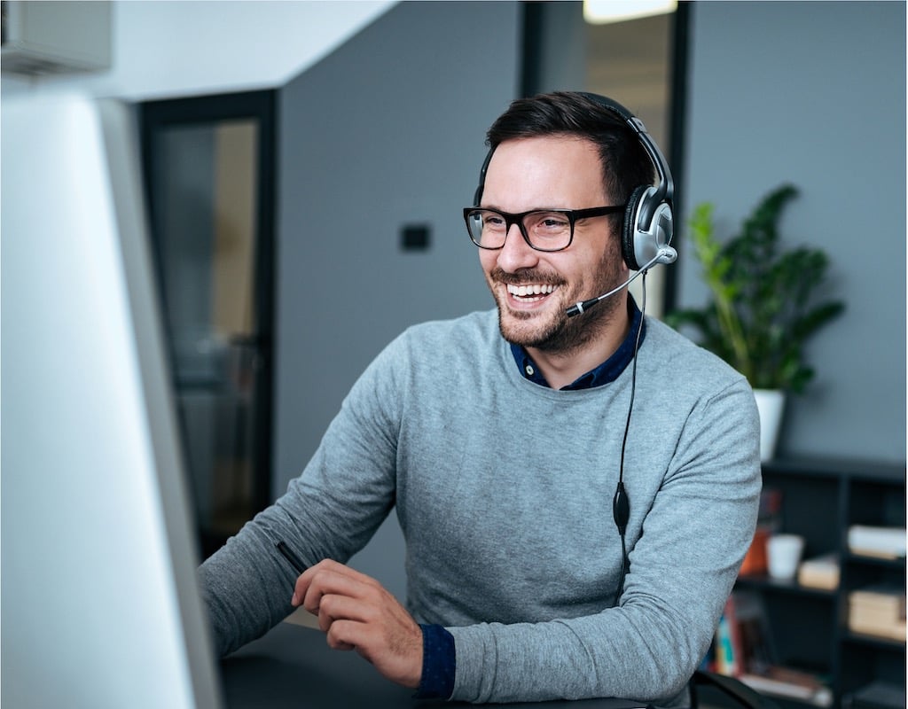 Man with a headset at a contact center