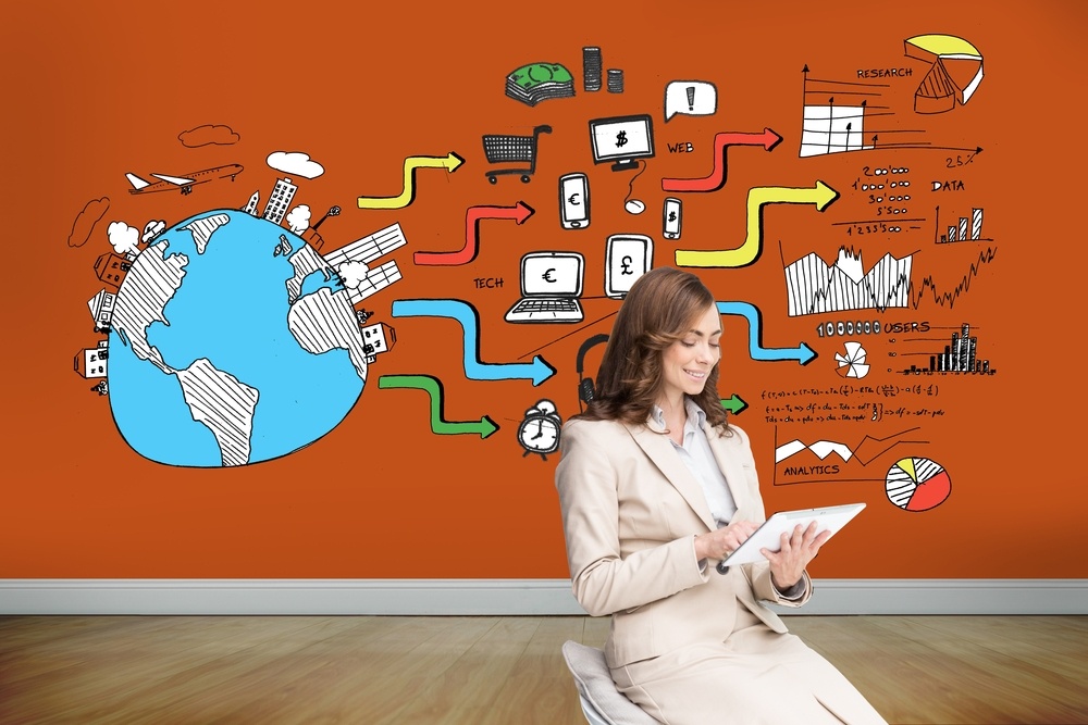 Composite image of pleased businesswoman using a tablet pc sitting on chair in front of orange wall showing economic illustrations
